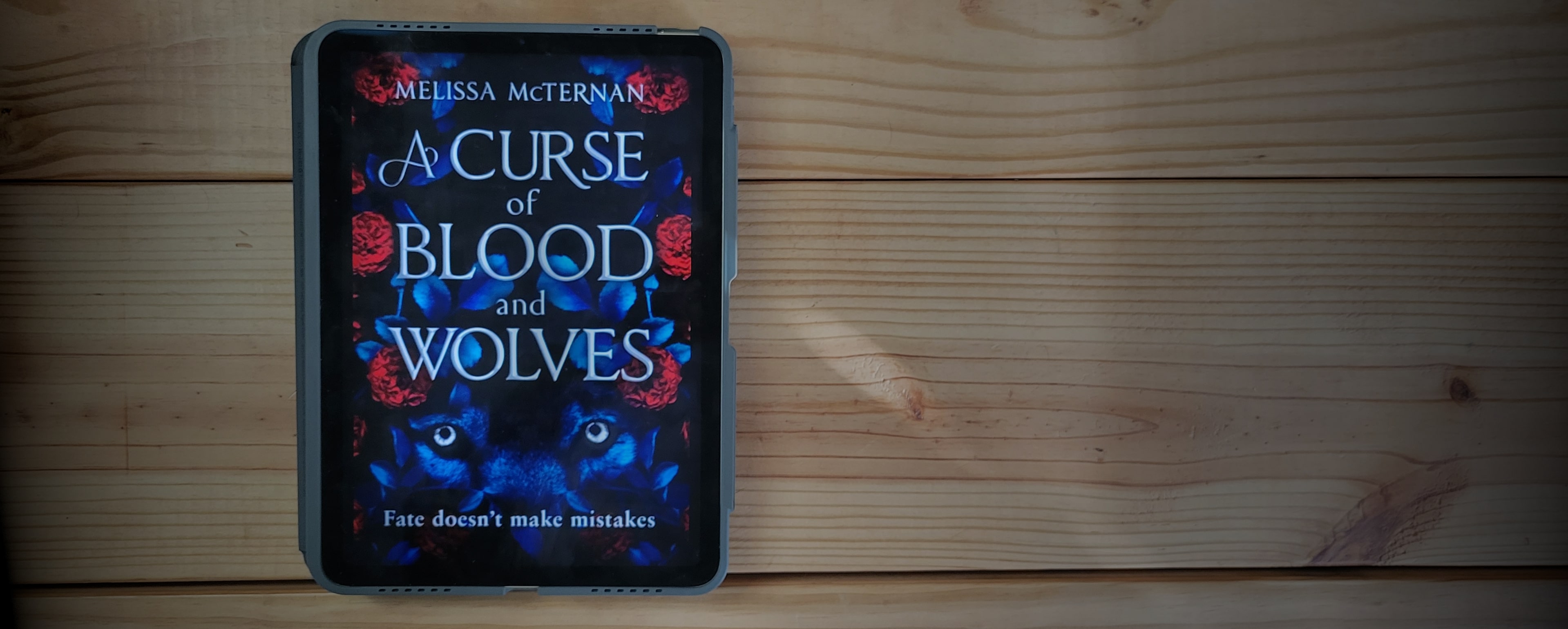 Book cover of A Curse of Blood and Wolves by Melissa McTernan